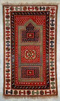Kazak Prayer Rug - The arch in a prayer rug represents the mihrab, or niche in the wall of the mosque closest to Mecca.